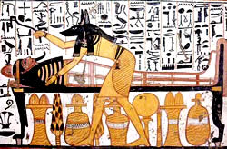 Бог Анубис в облике шакала во время проведения погребальных ритуалов