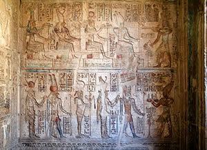 В числе главных божественных персоналий египетской мифологии  (второй слева в нижнем ряду). Рельеф из храма Птолемеев в Дейр-эль-Медине